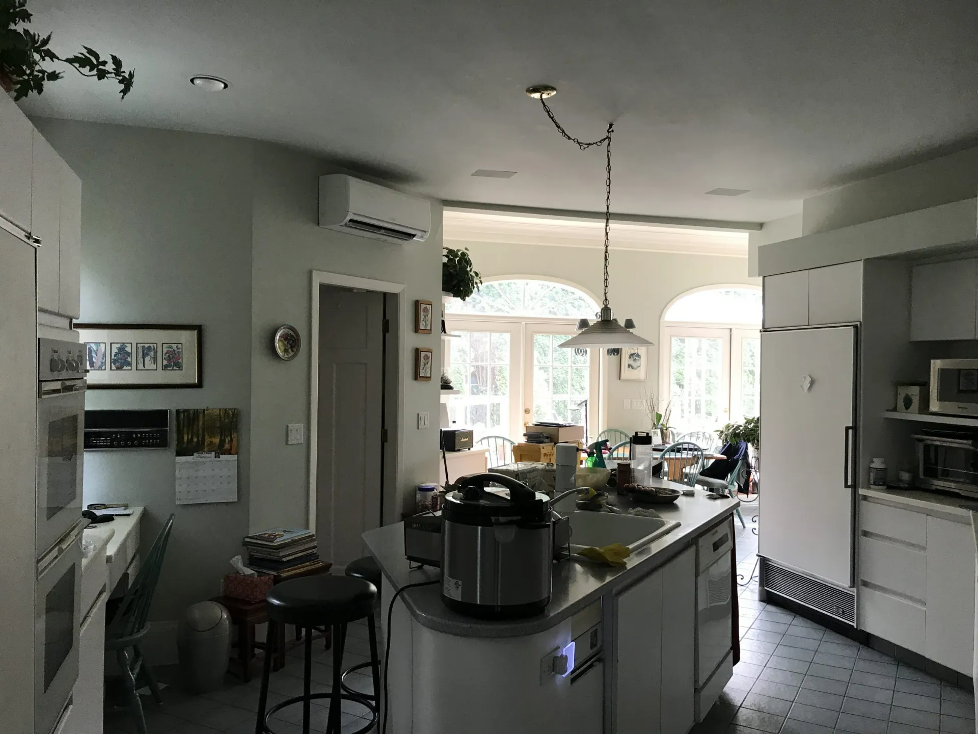 Modern kitchen with wall-mounted mini-split air conditioning unit