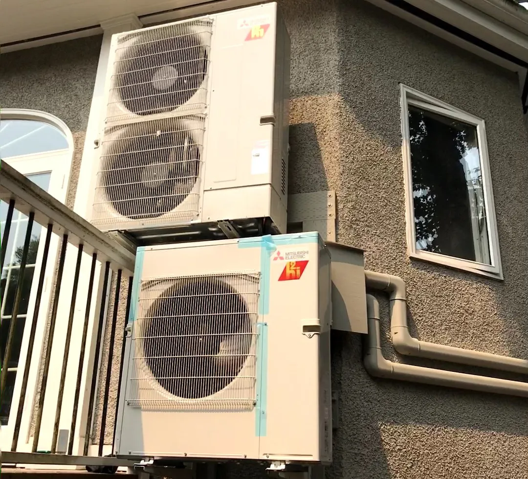Mitsubishi HVAC condensers mounted on exterior building wall